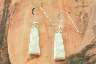 Stunning Fire and Ice Lab Opals inlaid between ribbons of Sterling Silver. Beautiful Sterling Silver French Wire Earrings feature precision channel inlay. Designed by Navajo Artist Calvin Begay. Signed.